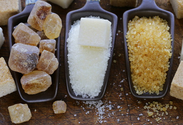 Different types of sugar - brown, white and refined sugar