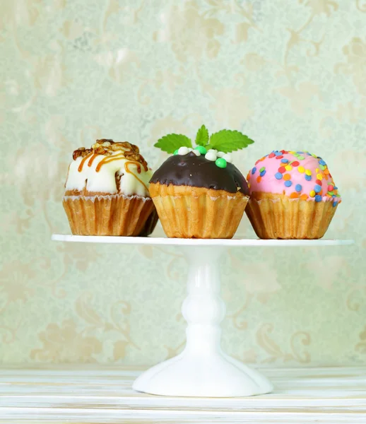 Holiday desserts, different decorated cupcakes on the stand — Stock Photo, Image