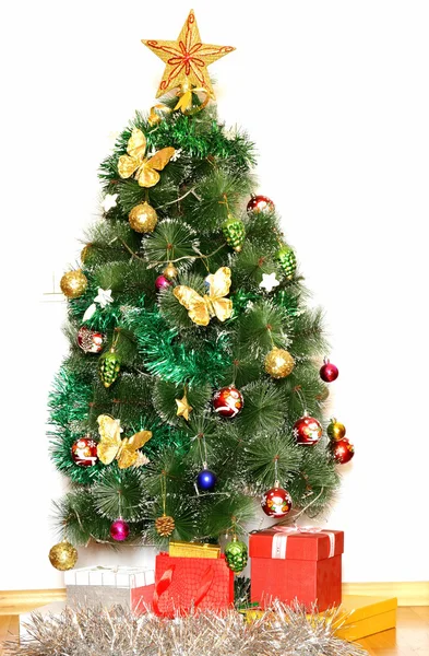 Big Christmas tree with decorations and gifts Stock Picture