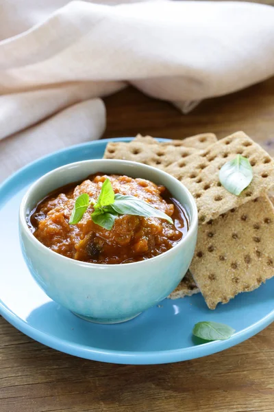 Vegetable ragout dip from eggplant and tomato with crisps — Stock Photo, Image