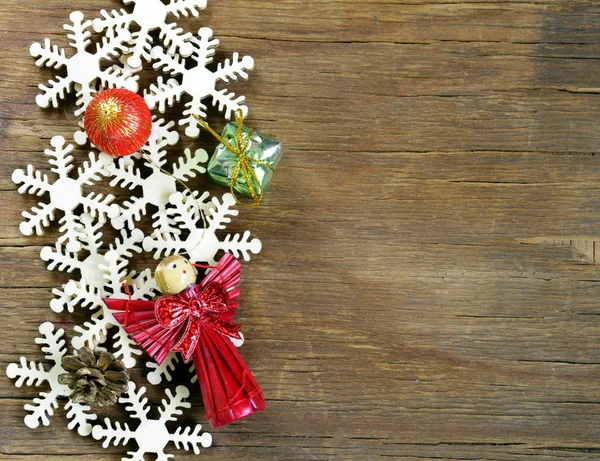 Decorazioni di sfondo di Natale e fiocchi di neve in legno — Foto Stock