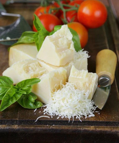 Fresh tasty hard parmesan cheese on a wooden board — Stock Photo, Image