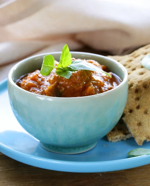 Vegetable ragout dip from eggplant and tomato with crisps — Stock Photo, Image