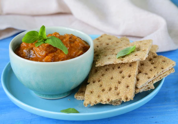 Vegetable ragout dip from eggplant and tomato with crisps — Stock Photo, Image