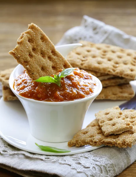 Vegetable ragout dip from eggplant and tomato with crisps — Stock Photo, Image