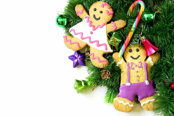 Traditional Christmas gingerbread man with festive decorations and Christmas tree — Stock Photo, Image