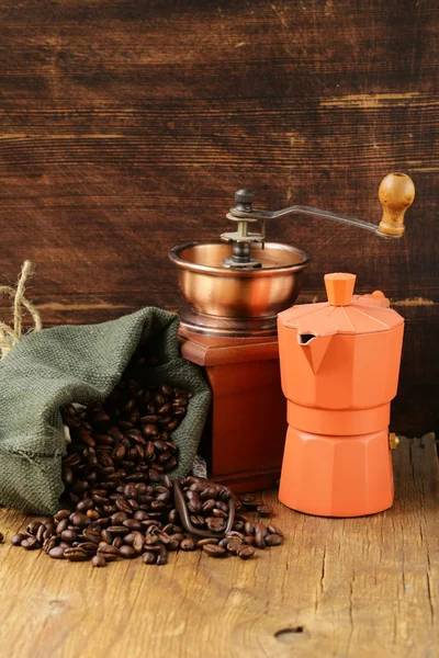 Still life coffee beans in a bag and coffee pot — Stock Photo, Image