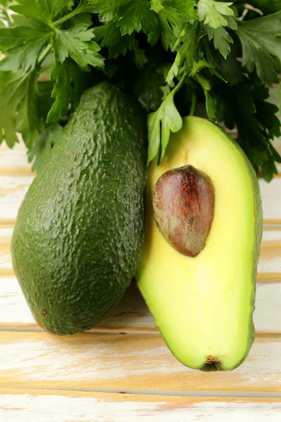 Fresh organic ripe avocado on a wooden table — Stock Photo, Image
