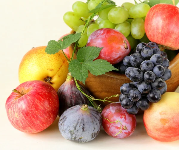 Assortment autumn harvest fruit (grapes, figs, apples, plums) — Stock Photo, Image