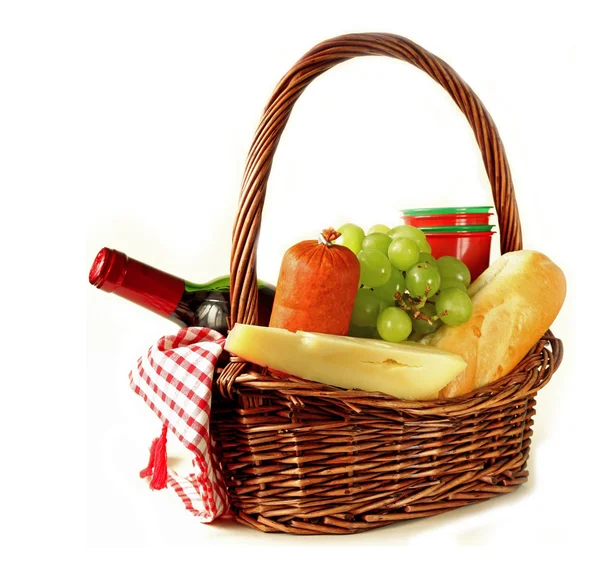 Picnic basket - wine, fruit, cheese and sausage — Stock Photo, Image