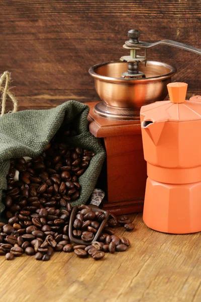 Still life coffee beans in a bag and coffee pot — Stock Photo, Image