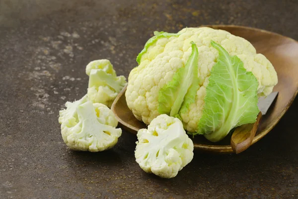 Fresh organic white cauliflower on old iron table — Stock Photo, Image