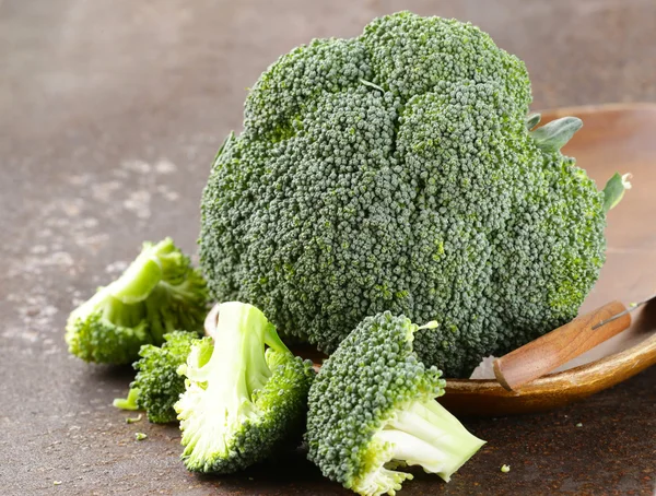 Fresh organic green cabbage broccoli on old iron table — Stock Photo, Image