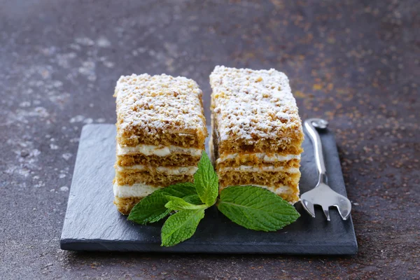 Piece of delicious dessert festive cake with chocolate and fruits — Stock Photo, Image