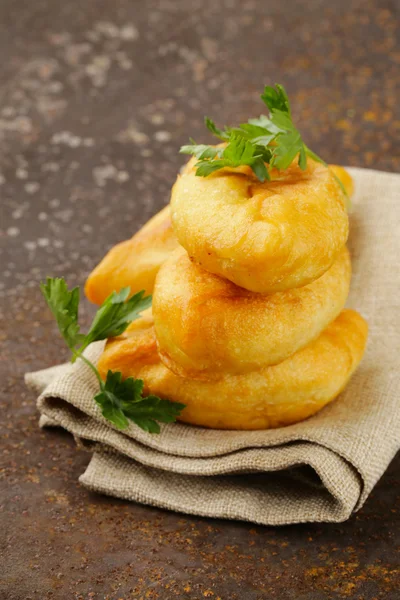 Homemade fried pies with potatoes, rustic style