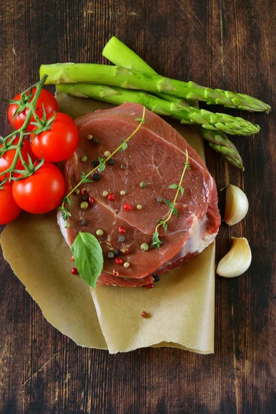 Piece of raw meat beef steak with spices and herbs — Stock Photo, Image