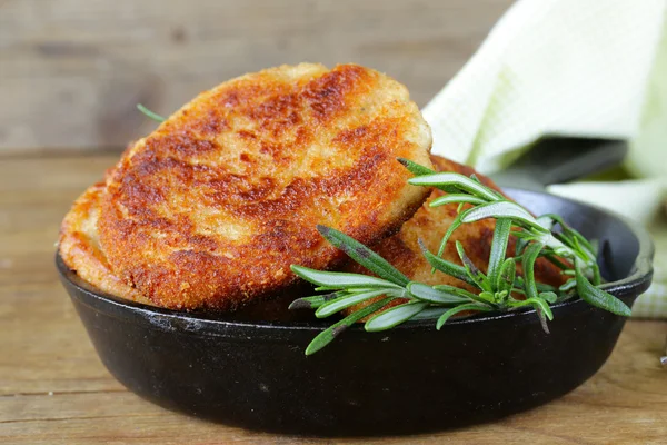 Roasted meat burgers with rosemary in a pan — Stock Photo, Image