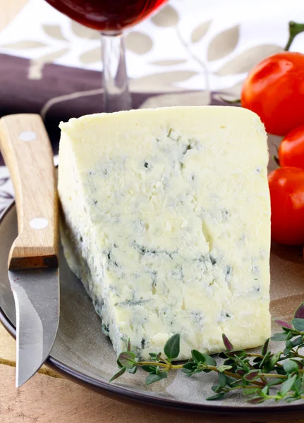 Piece of blue cheese with fruits and herbs — Stock Photo, Image