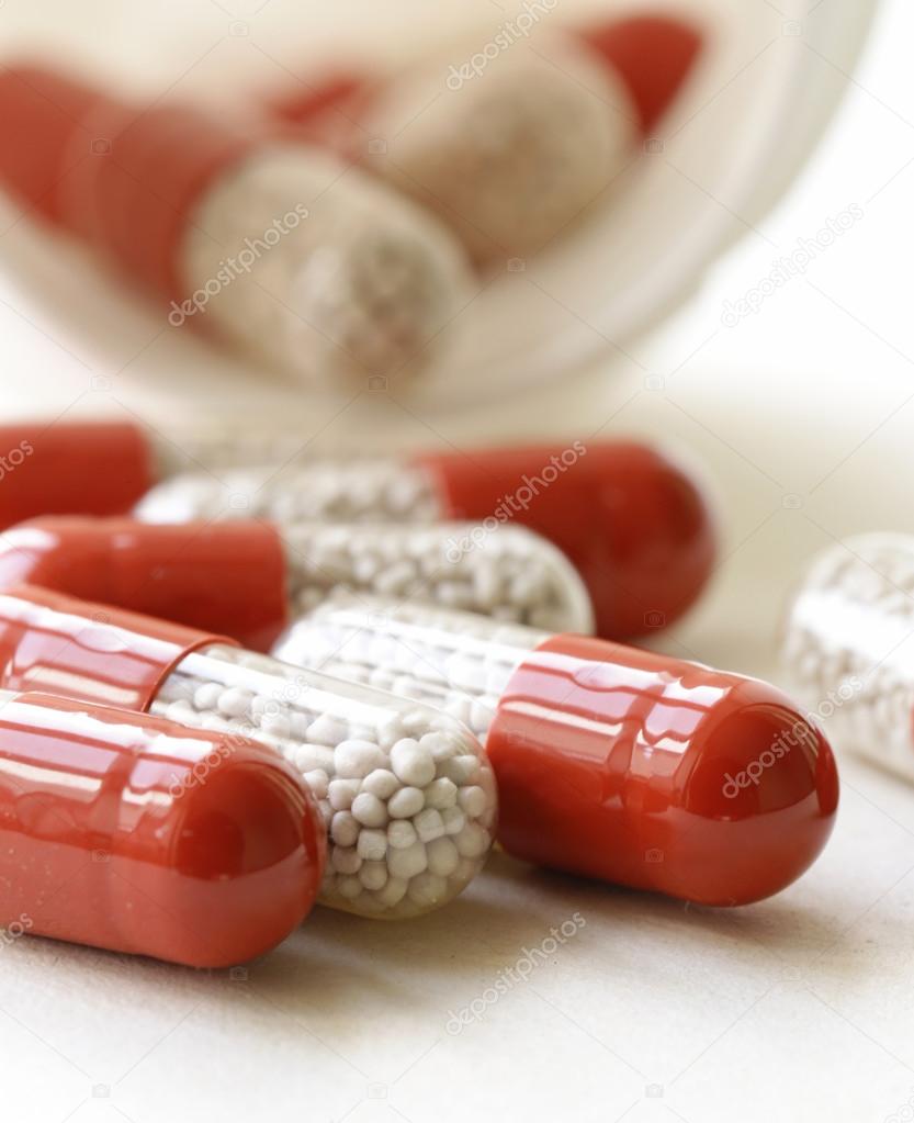 Heap pills capsule on a white background close-up