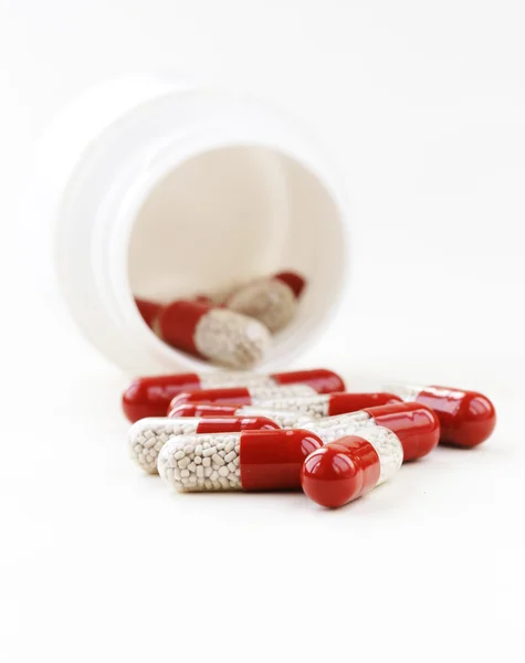 Heap pills capsule on a white background close-up — Stock Photo, Image