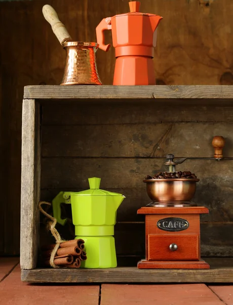 Coffee beans and different utensils for boiling coffee (grinder, kettle, cezve) — Stock Photo, Image