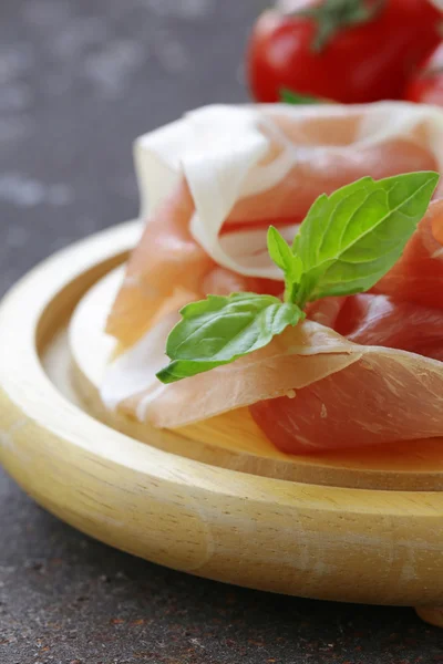 Parma ham (jamon) with fragrant herbs traditional Italian meat appetizer — Stock Photo, Image