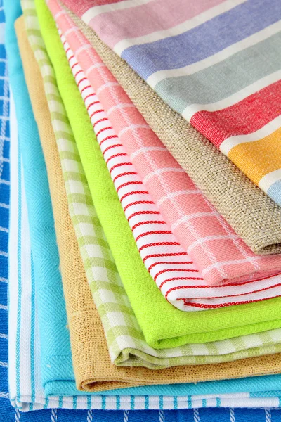 Stack of colorful kitchen napkins on white background — Stock Photo, Image