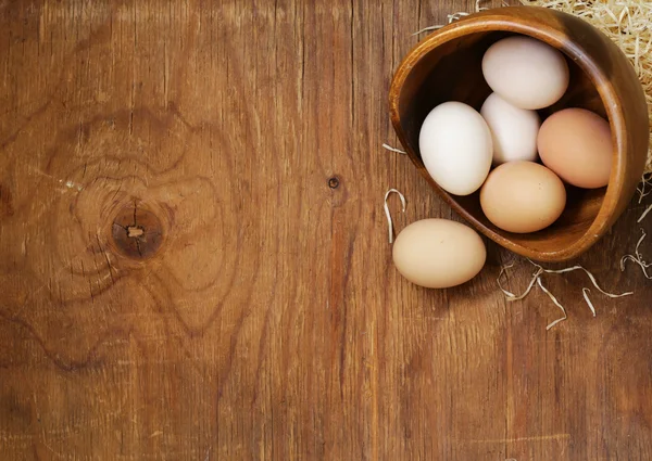 Farm natural organic eggs on a wooden background — Stock Photo, Image