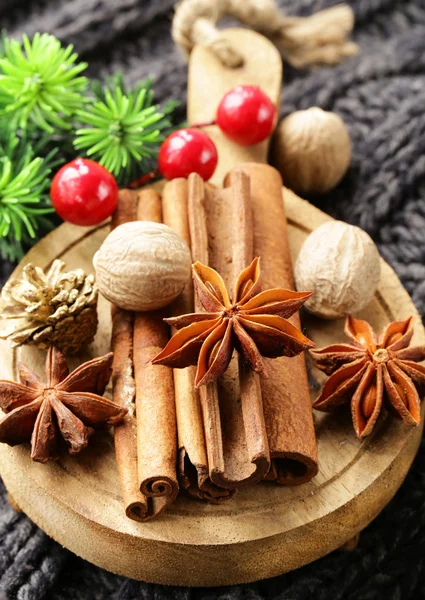 Spices anise, cinnamon, nutmeg on warm knitted background — Stock Photo, Image