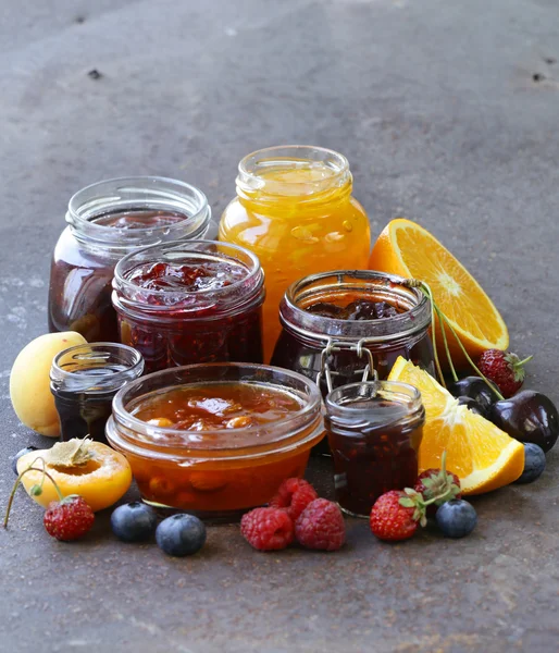 Assorted fruit berry jams (apricot, strawberry, raspberry, orange) — Stock Photo, Image