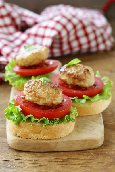 Appetizer mini burgers with tomatoes, lettuce and meat balls — Stock Photo, Image