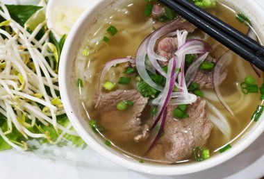 traditional Vietnamese pho bo soup with bean sprouts