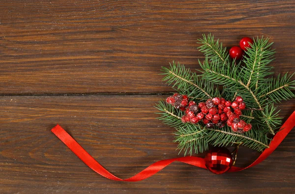 Christmas wooden background with fir branches and decoration — Stock Photo, Image