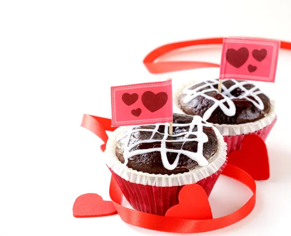 Festive pastry for Valentine's Day, chocolate muffin with red hearts — Stock Photo, Image