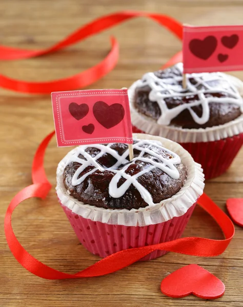 Festive pastry for Valentine's Day, chocolate muffin with red hearts — Stock Photo, Image