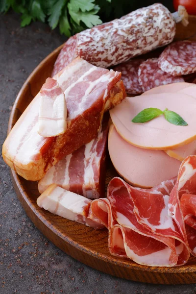 Assorted deli meats - ham, sausage, salami, parma, prosciutto, bacon — Stock Photo, Image