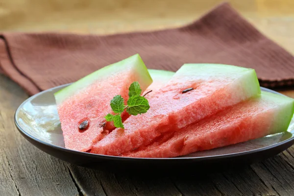 Fresh ripe watermelon sliced on a plate — Stock Photo, Image
