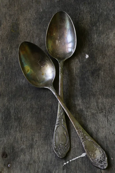 Vintage silver spoons on a wooden background — Stock Photo, Image