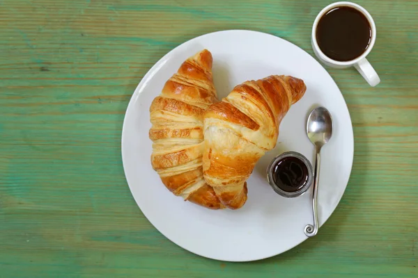 Traditional croissants with jam for breakfast — Stock Photo, Image