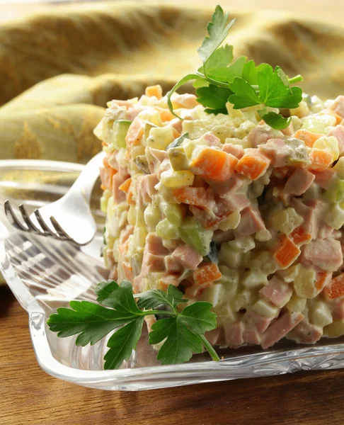 Traditional Russian salad with mayonnaise and vegetables — Stock Photo, Image