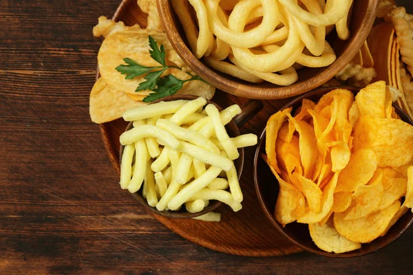 Assorted different kinds of chips - onion rings, sticks and flat — Stock Photo, Image