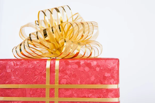 Single red gift box with gold ribbon . — Stock Photo, Image