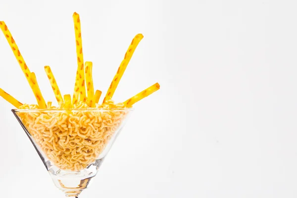 Pretzel snacks in glass over white background. — Stock Photo, Image