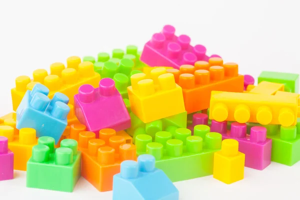 Toy building colorful blocks on white paper background — Stock Photo, Image