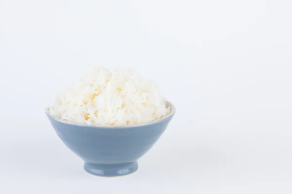 Cuenco lleno de arroz sobre fondo de papel blanco — Foto de Stock