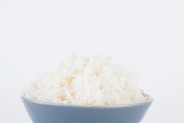 Bowl full of rice on white paper background — Stock Photo, Image