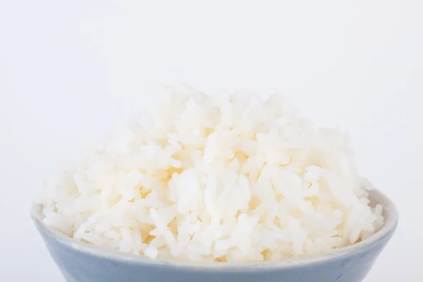 Cuenco lleno de arroz sobre fondo de papel blanco —  Fotos de Stock