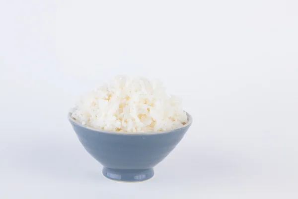 Bowl full of rice on white paper background — Stock Photo, Image