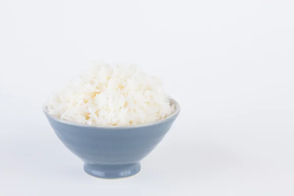 Bowl full of rice on white paper background — Stock Photo, Image