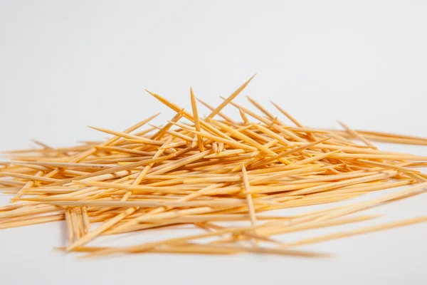Bunch of toothpicks on white paper background — Stock Photo, Image